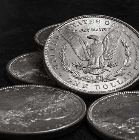 a close up of a few silver dollars