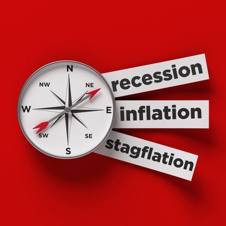 a compass points to the words recession, inflation, stagflation