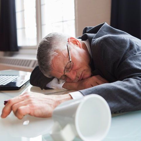 banker asleep at his desk