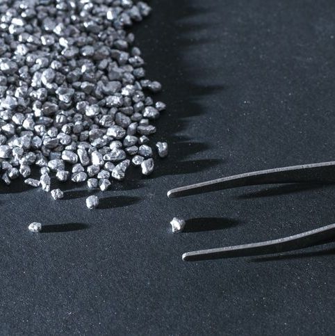 tiny silver nuggets and tweezers