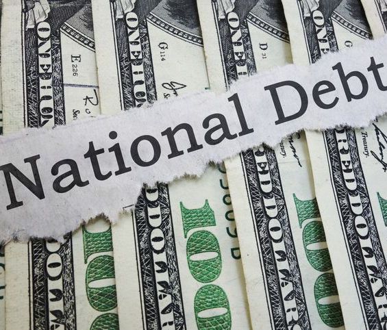 the words National Debt across a pile of dollar bills