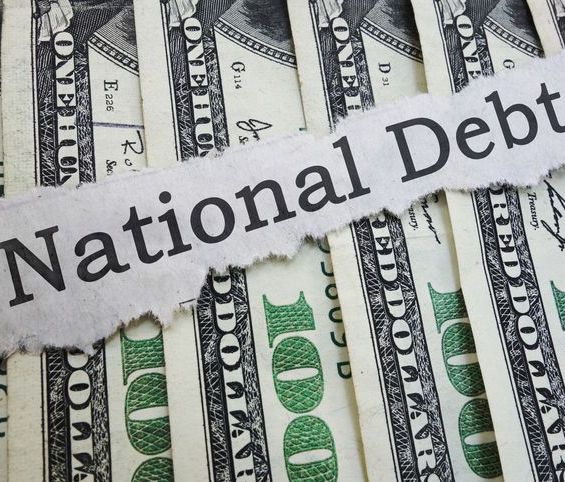 national debt on torn paper